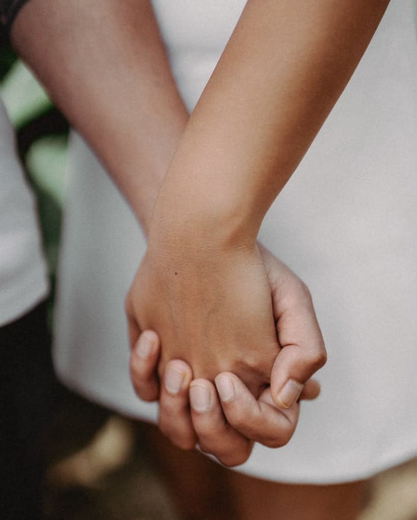 Close-up of a couple holding hands